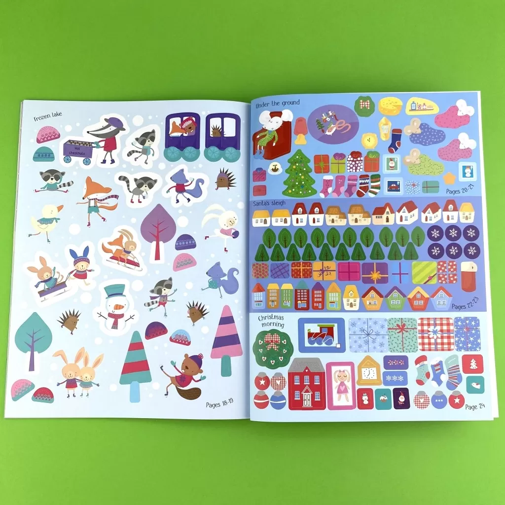A photo of an interior spread in the Christmas Sticker Book full of cute winter stickers.