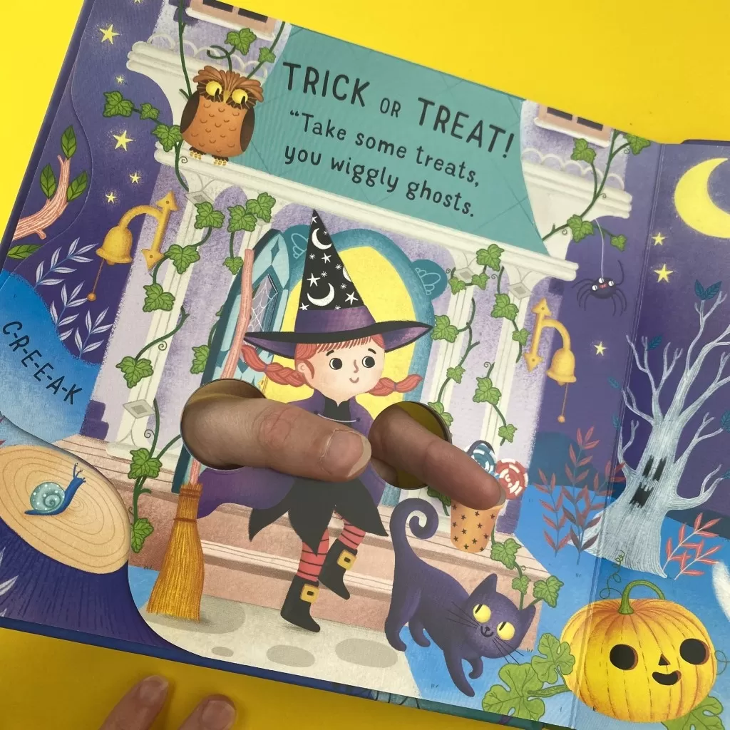 An interior spread of Fingerwiggly Ghosts, featuring a little with on it who says 'TRICK OR TREAT! Take some treats you wriggly ghosts!"