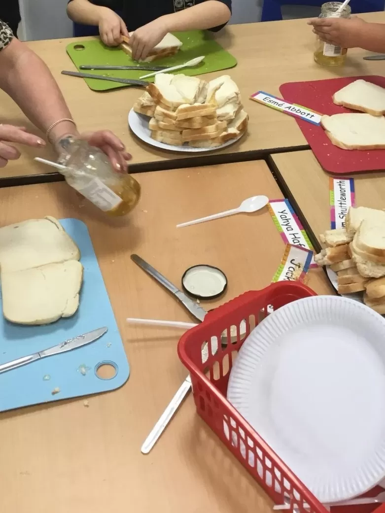 Children making marmalade sandwiches